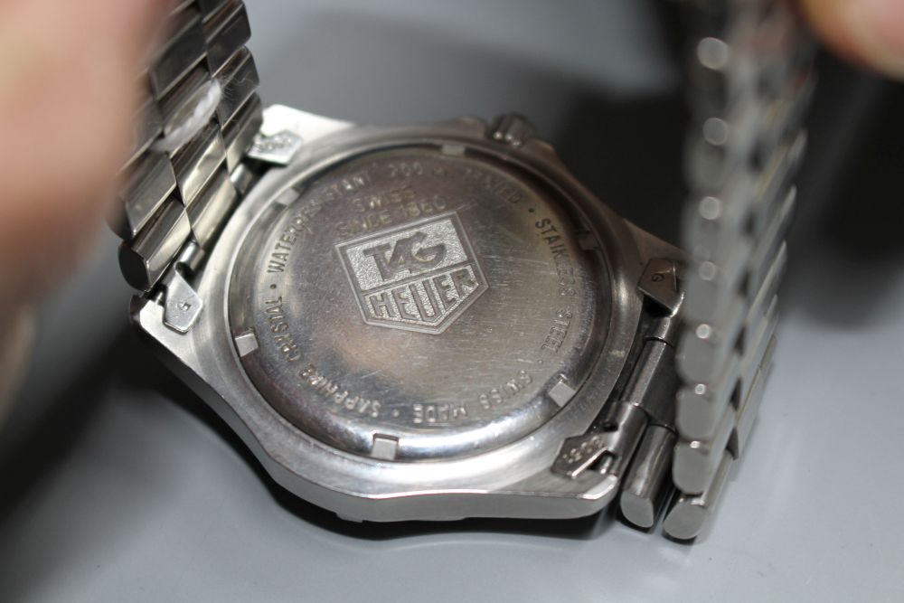 A gentlemans stainless steel Tag Heuer Professional quartz wrist watch, on steel Tag bracelet.